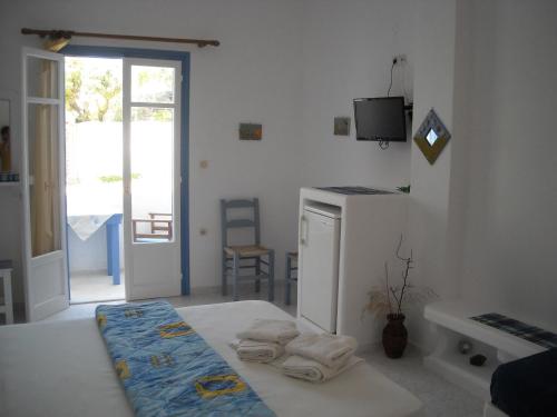 Ένα ή περισσότερα κρεβάτια σε δωμάτιο στο Ostria Vento