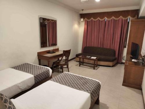 Hotel Adityaにあるベッド