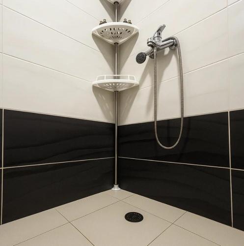 a bathroom with a shower and a sink at Beach Apartment Relax & Unwind in Lalzit Bay