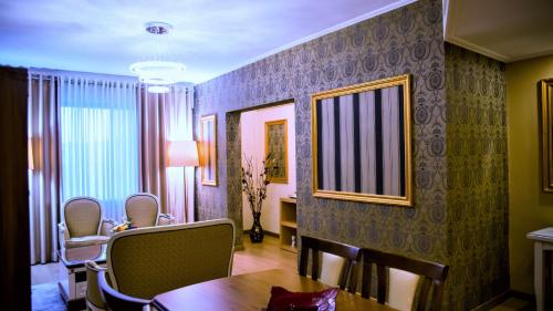 a dining room with a table and chairs at Tirana International Hotel & Conference Center in Tirana