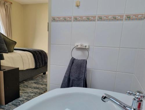Ένα ή περισσότερα κρεβάτια σε δωμάτιο στο Paradise Tide - 4 Bedroom Beachfront home with Private Pool