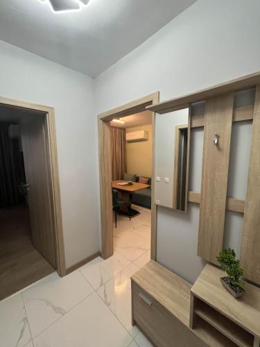 a room with a hallway with a desk and a table at Apartmenthaus Oborishte - 9 in Panagyurishte