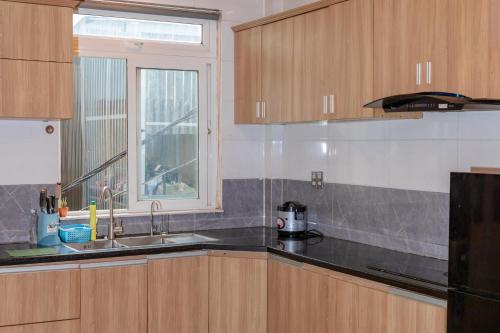 a kitchen with a sink and a window at D Home Da Lat 3 in Da Lat