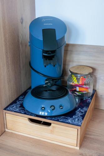 a blue blender sitting on top of a counter at Le cocon du Centre in Dunkerque