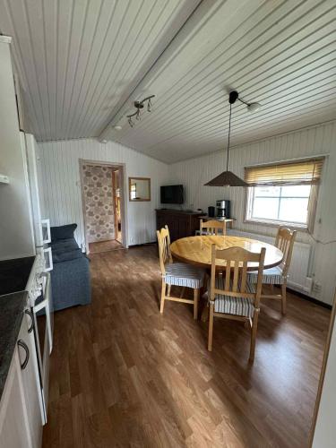 a kitchen and dining room with a table and chairs at Dundret 1 in Gällivare