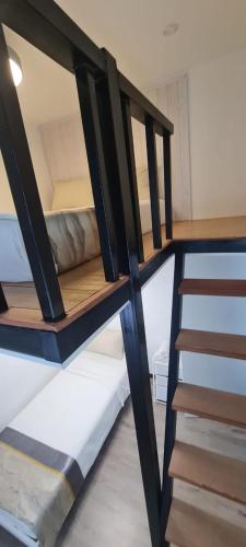 a bunk bed room with two bunk beds and a staircase at Damai Antara Homestay in Putrajaya