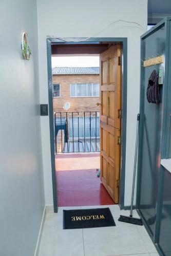 an open door with a view of a balcony at Springs Sleeper's Delight in Springs