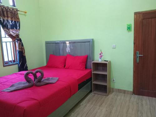 Ένα ή περισσότερα κρεβάτια σε δωμάτιο στο Glampar Homestay
