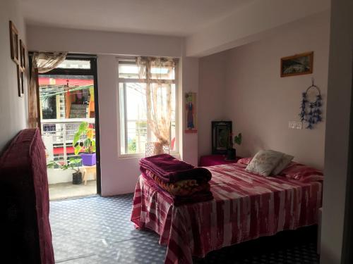 Postel nebo postele na pokoji v ubytování Naayuma Homestay