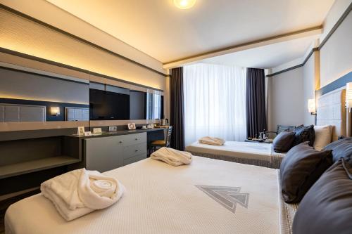 Postel nebo postele na pokoji v ubytování VONRESORT Golden Coast & Aqua - Kids Concept-Ultra All Inclusive