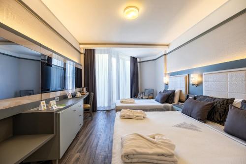 Postel nebo postele na pokoji v ubytování VONRESORT Golden Coast & Aqua - Kids Concept-Ultra All Inclusive