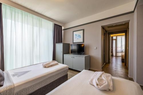 Postel nebo postele na pokoji v ubytování VONRESORT Golden Coast & Aqua - Kids Concept-Ultra All Inclusive