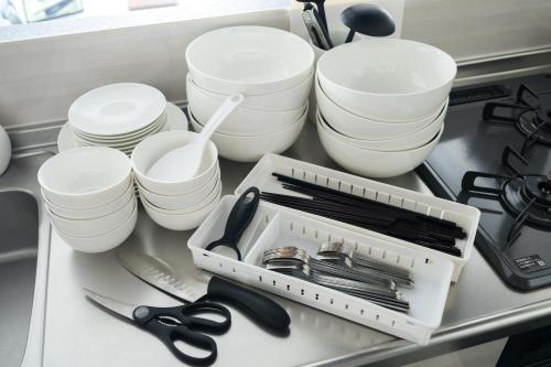 a drawer filled with white dishes and utensils at Sun Court Nango-dori サンコート南郷通 501 in Sapporo