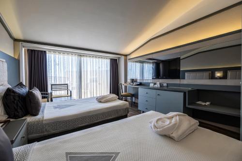 Postel nebo postele na pokoji v ubytování VONRESORT Golden Coast & Aqua - Kids Concept-Ultra All Inclusive