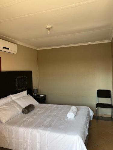 Ένα ή περισσότερα κρεβάτια σε δωμάτιο στο Satoka Guest House