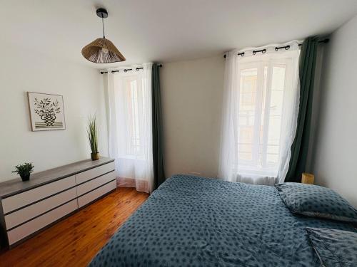 Katil atau katil-katil dalam bilik di Le Toit Terrasse l 2 chambres l Terrasse