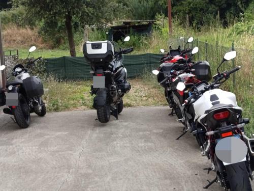 a group of motorcycles parked next to each other at La Sosta in Lunigiana in Monti di Licciana Nardi