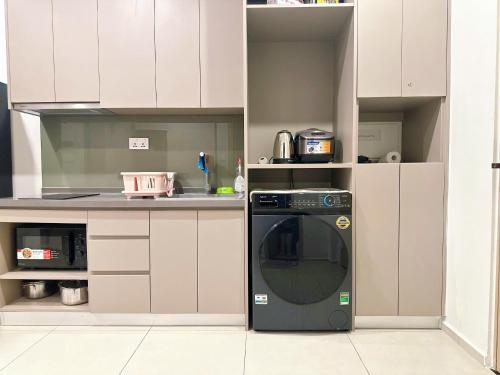 Kuchyň nebo kuchyňský kout v ubytování The Song Premium Apartment - Căn Hộ Du Lịch Biển - Anh Khoa Homestay