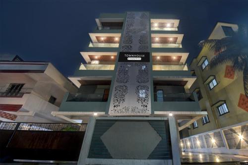 a tall building with a sign on the front of it at Collection O Mahadevapura Opposite Phoenix Mall in Bengaluru