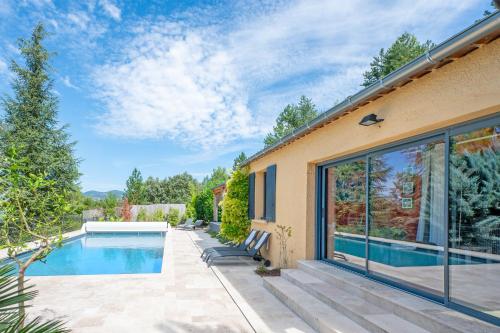 a house with a swimming pool and a patio at Coste in Mollans-sur-Ouvèze