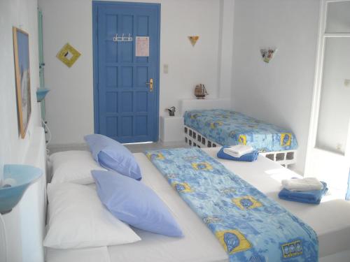 Ένα ή περισσότερα κρεβάτια σε δωμάτιο στο Ostria Vento