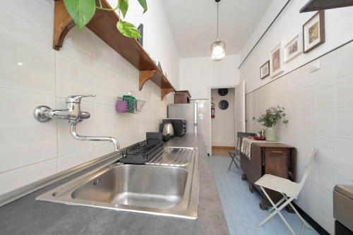 a kitchen with a large stainless steel sink at Giuliana Vatican Family Home in Rome