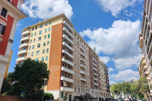 a tall apartment building in the middle of a street at Giuliana Vatican Family Home in Rome