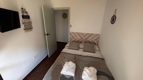 a small room with a bed in the corner at La Casa de la Abuela in Higueruela