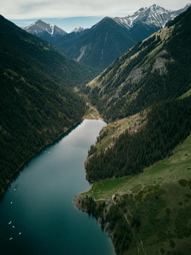 an aerial view of a lake in the mountains at Pana Unique Kolsay in Kurmenty