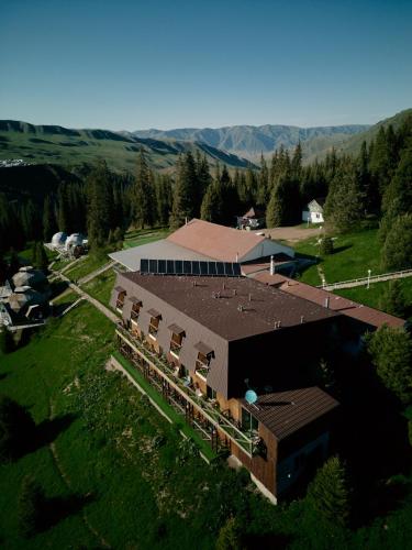 an overhead view of a building with a train at Pana Unique Kolsay in Kurmenty