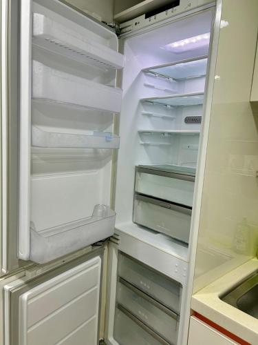 an empty refrigerator with its door open in a kitchen at SP Perfect studio in front of Sillim Station 4min, Dorimcheon in Samgong