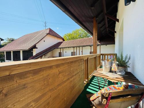 a wooden deck with a wooden fence on a house at Landgasthof Sagenhaft in Klagenfurt