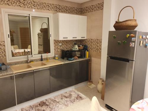 Η κουζίνα ή μικρή κουζίνα στο Cozy apartment by the cost