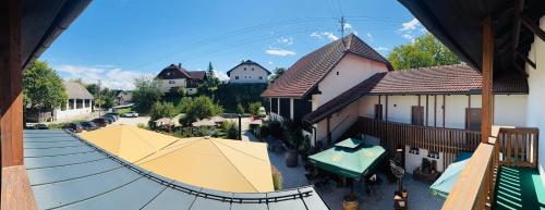 an overhead view of a house with a table and tent at Landgasthof Sagenhaft in Klagenfurt