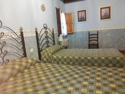 Ένα ή περισσότερα κρεβάτια σε δωμάτιο στο Casa Entrenidos