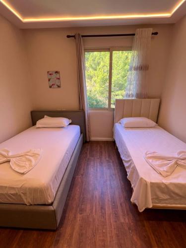 Ένα ή περισσότερα κρεβάτια σε δωμάτιο στο Sea View Apartments