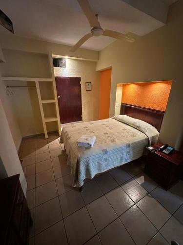 Postel nebo postele na pokoji v ubytování Hotel D´ Carmona