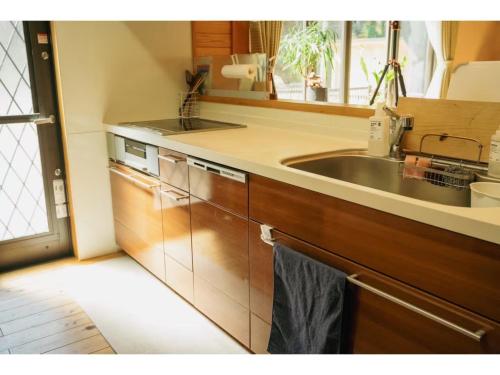 a kitchen with a sink and a counter top at Keiryusou - Vacation STAY 50707v in Kinokawa