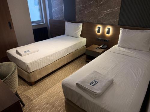 Postel nebo postele na pokoji v ubytování Tetrainn hotel