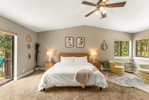 a bedroom with a bed and a ceiling fan at Spacious Comfort in Scenic Monument in Monument