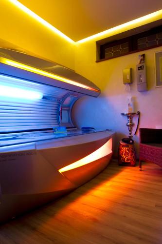 a boat is sitting in a room with lights at Vakantiehotel Der Brabander in Winterberg