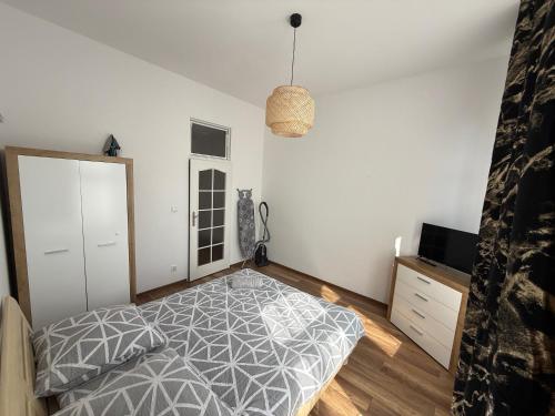 Ένα ή περισσότερα κρεβάτια σε δωμάτιο στο Apartament Panorama Centrum