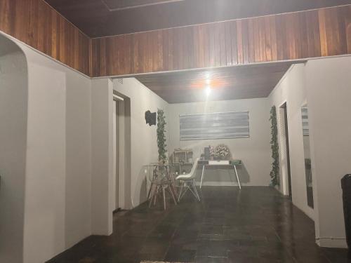 a living room with a table and chairs in it at FullHouse in Soweto