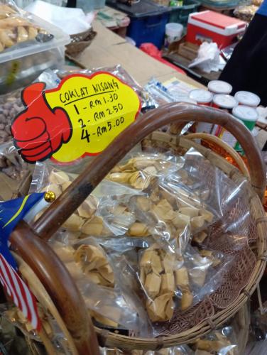 a basket of food with a price sign on it at Lu&Lu Rooms & Homestay in Dungun
