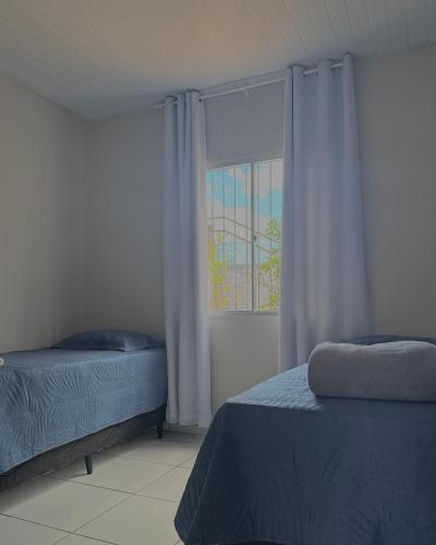 Postel nebo postele na pokoji v ubytování Tropi casa