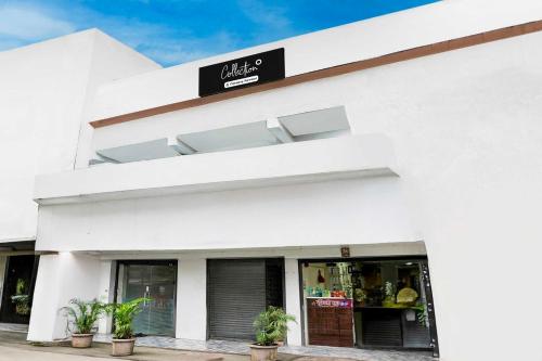 a white building with a sign on it at Collection O Dombivali in Mumbai
