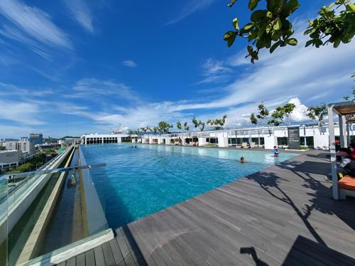a large swimming pool on the roof of a building at Sutera Avenue Opposite Imago Shopping Mall KK in Kota Kinabalu