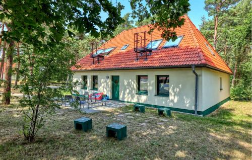 a small house with an orange roof at Nice Apartment In Altenkirchen in Altenkirchen