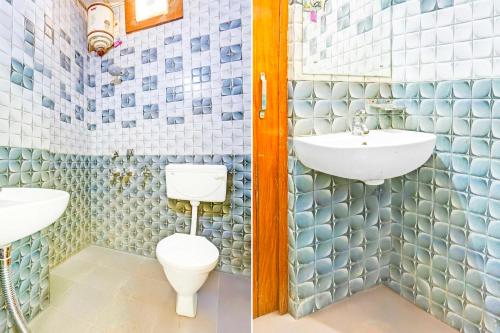 a bathroom with a toilet and a sink at Collection O Sector 45 in Chandīgarh