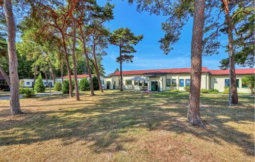 a building with trees in front of it at Gorgeous Apartment In Altenkirchen in Altenkirchen